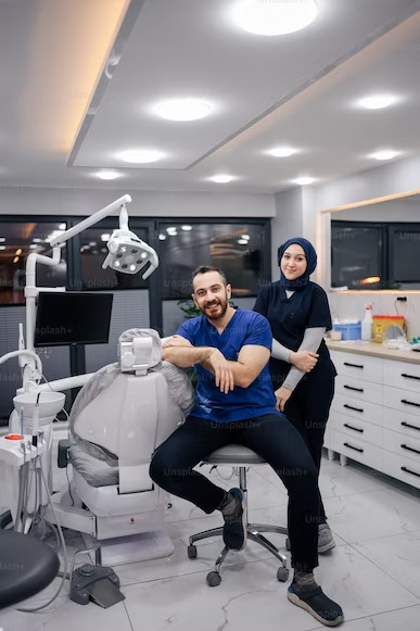 photo of a dentist with his assistant inside their dental clinic
