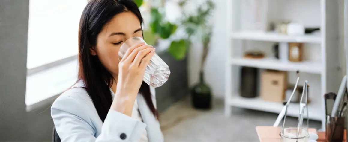 woman drinking water not affected by flouride
